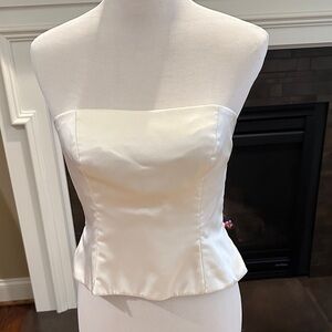 Silk strapless top. Tab and full zip in center back.